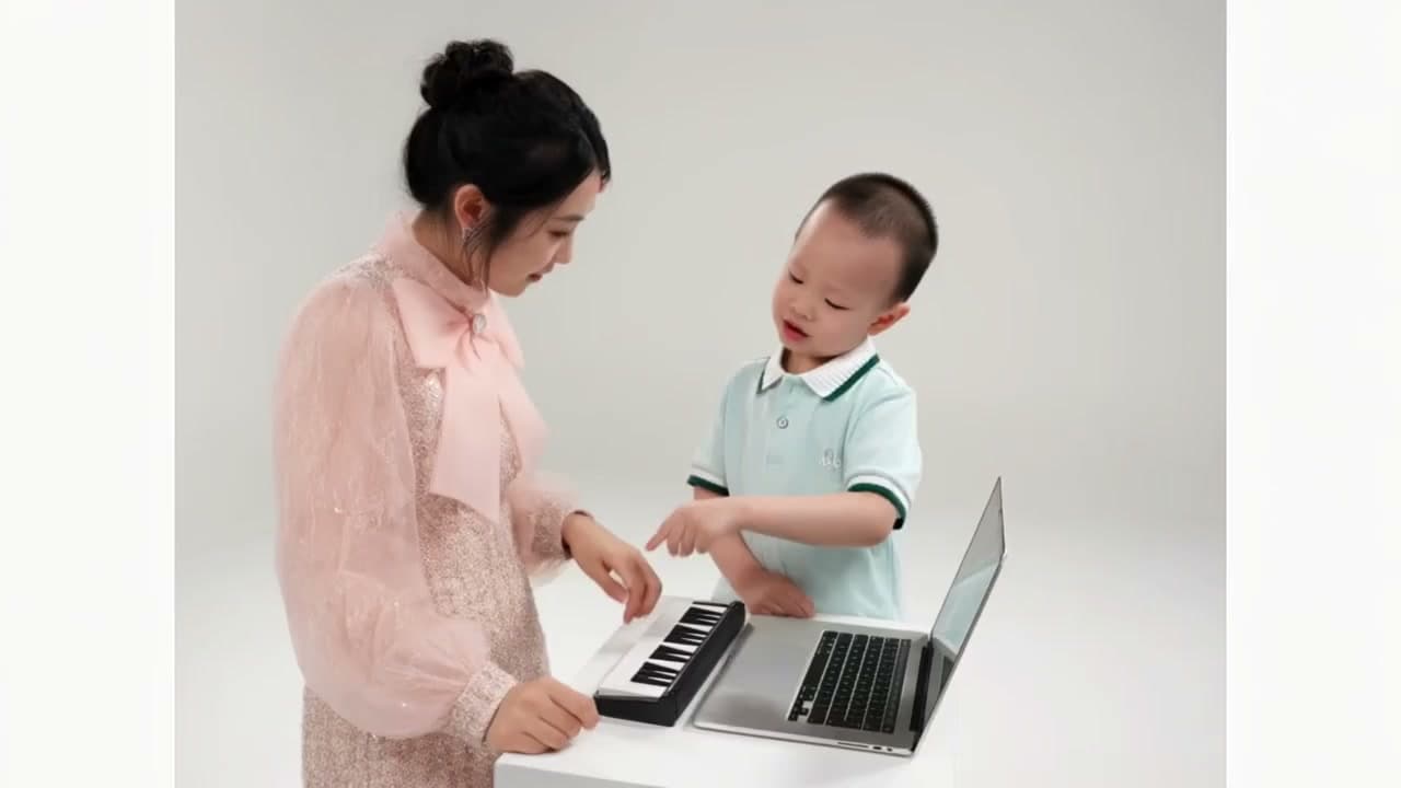 Generated example showing a woman at the keyboard on the left and a child beside the laptop on the right in a white studio.