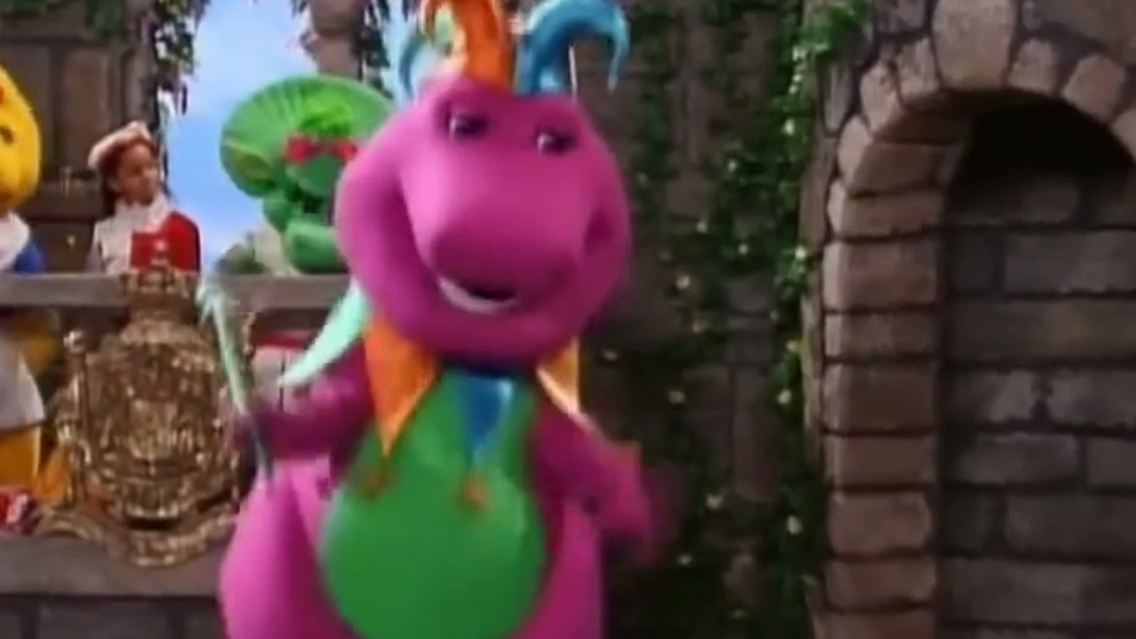 A wide crop of Barney smiling in the stone-arch scene from thebarneycentral’s edit.